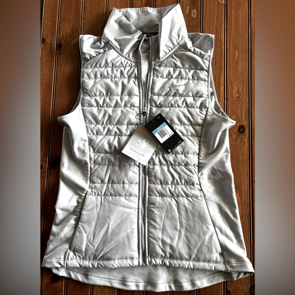 Women's Nike vest. Size medium. Color is light grey.
